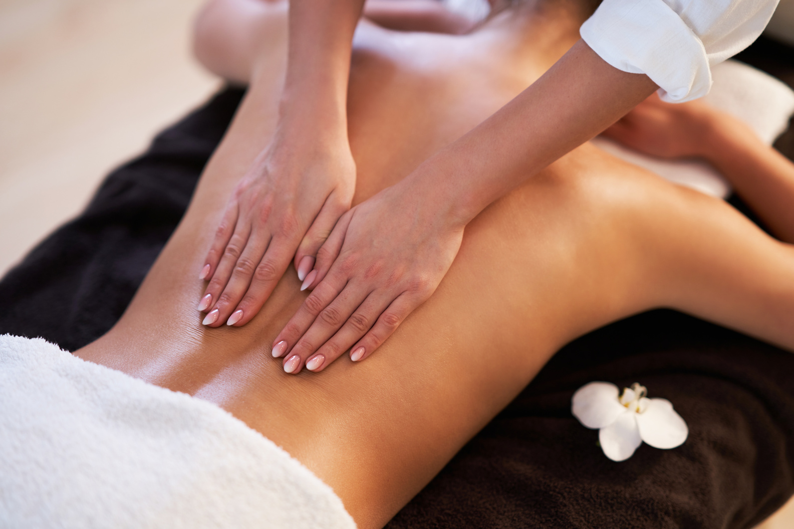 Relaxed Woman Receiving a Back Massage